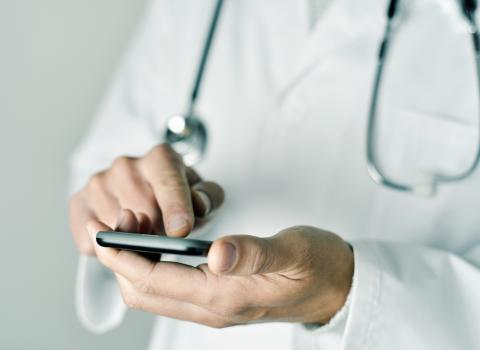 Bupa Cromwell – image of clinician using mobile app 